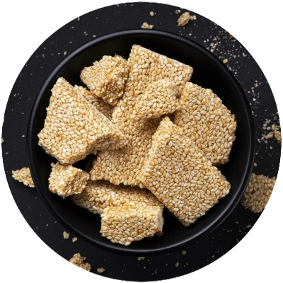 sesame kozinaki in black bowl